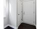 Hallway featuring dark wood floors, white walls, and white doors at 1444 Waterleaf Dr, Westfield, IN 46074