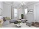 Bright living room features recessed lighting, a modern sofa and contemporary decor at 1444 Waterleaf Dr, Westfield, IN 46074