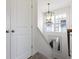 This stairwell includes closet doors and a pendant light at 1444 Waterleaf Dr, Westfield, IN 46074