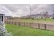 View of the expansive, green backyard and surrounding houses from the upper deck at 1472 Windpump Way, Carmel, IN 46280