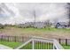 View of well maintained backyard and neighborhood homes from an elevated deck at 1472 Windpump Way, Carmel, IN 46280
