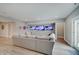 Inviting basement living room with three mounted TVs, a comfortable sectional, and ample space for relaxation and entertainment at 1472 Windpump Way, Carmel, IN 46280