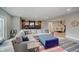 Finished basement featuring a comfortable sectional sofa, a wet bar, and a dining area, perfect for entertaining guests at 1472 Windpump Way, Carmel, IN 46280