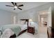 Bedroom featuring a bedside table with lamp and view to hallway at 1472 Windpump Way, Carmel, IN 46280