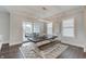 Dining room with wood table, bench seating, modern lighting, and access to outdoor patio at 1472 Windpump Way, Carmel, IN 46280