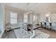 Dining area featuring a wood table, seating for six, and open access to the kitchen at 1472 Windpump Way, Carmel, IN 46280