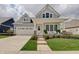 Charming craftsman home with inviting front porch and landscaped lawn at 1472 Windpump Way, Carmel, IN 46280