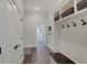 Hallway with hooks, and a bench offers practical storage and organization at 1472 Windpump Way, Carmel, IN 46280