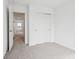 Bedroom featuring carpet flooring, a closet, and neutral walls at 1554 N Clearwater Dr, Greenfield, IN 46140