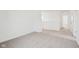 Neutral bedroom with carpeted floors, a hallway view and neutral colors at 1554 N Clearwater Dr, Greenfield, IN 46140