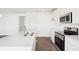 Bright white kitchen featuring a kitchen island and stainless steel appliances at 1554 N Clearwater Dr, Greenfield, IN 46140