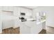 Bright white kitchen featuring a kitchen island and stainless steel appliances at 1554 N Clearwater Dr, Greenfield, IN 46140