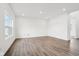 Open living room with recessed lighting and stylish light wood flooring at 1554 N Clearwater Dr, Greenfield, IN 46140