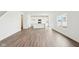 Open-concept living room featuring hardwood floors and white walls at 1554 N Clearwater Dr, Greenfield, IN 46140