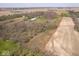 Expansive aerial view of the property, featuring a mix of fields, trees, and open space at 16471 E 196Th St, Noblesville, IN 46060
