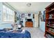 Bright bedroom with carpet, a built-in bookcase, a dresser, and plenty of natural light at 16471 E 196Th St, Noblesville, IN 46060