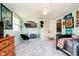 bedroom with light-green walls, carpeted floors, ceiling fan, and a window for natural light at 16471 E 196Th St, Noblesville, IN 46060