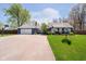 Charming blue home with a well-manicured lawn, attached garage, and a basketball hoop at 16471 E 196Th St, Noblesville, IN 46060