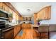 Traditional kitchen offers light wood cabinets, breakfast bar, and stainless steel appliances at 16471 E 196Th St, Noblesville, IN 46060