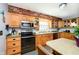 Traditional kitchen featuring light wood cabinets, stainless steel microwave and oven at 16471 E 196Th St, Noblesville, IN 46060