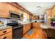 Traditional kitchen features light wood cabinets and stainless steel appliances at 16471 E 196Th St, Noblesville, IN 46060
