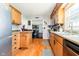 Open concept kitchen features light wood cabinets and laminate floor at 16471 E 196Th St, Noblesville, IN 46060