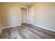 Bedroom featuring closet access and wood-look flooring at 1760 Market St, Martinsville, IN 46151