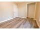 Bedroom featuring closet access and wood-look flooring at 1760 Market St, Martinsville, IN 46151
