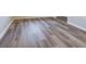 Close up of the neutral wood-look flooring throughout the home at 1760 Market St, Martinsville, IN 46151