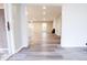 Bright and airy living room features wood-look flooring, fireplace, and open access to the kitchen at 1760 Market St, Martinsville, IN 46151
