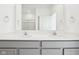 Bathroom featuring double sinks with modern fixtures, and a well-lit mirror at 19245 Red Willow Ln, Noblesville, IN 46062