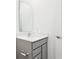 Well-lit bathroom featuring a modern vanity with gray cabinetry and a sleek countertop at 19245 Red Willow Ln, Noblesville, IN 46062