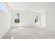 A spacious bedroom with large windows provides bright natural light at 19245 Red Willow Ln, Noblesville, IN 46062