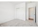 Bright, carpeted bedroom with a closet and an open doorway at 19245 Red Willow Ln, Noblesville, IN 46062