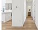 Hallway featuring hardwood flooring and access to the kitchen and other rooms at 19245 Red Willow Ln, Noblesville, IN 46062