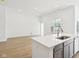 Modern kitchen featuring a bright, spacious layout with a white countertops, and hardwood floors at 19245 Red Willow Ln, Noblesville, IN 46062