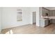 Open-concept kitchen and living space featuring modern cabinets and beautiful flooring at 19245 Red Willow Ln, Noblesville, IN 46062