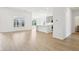 Bright, open-concept living room and kitchen featuring hardwood floors and lots of natural light at 19245 Red Willow Ln, Noblesville, IN 46062