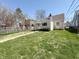 Spacious backyard with a well-kept lawn, surrounded by a wooden and chain-link fence, offering ample space at 2050 Winton Ave, Indianapolis, IN 46224