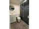 Full bathroom featuring a vanity sink, toilet, and stand up shower with sliding doors at 2050 Winton Ave, Indianapolis, IN 46224