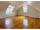 Bright bedroom with wood floor, fresh paint, and natural light from two windows at 2050 Winton Ave, Indianapolis, IN 46224
