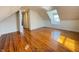 The bonus room features beautiful wood floors, wainscotting, and dormer window at 2050 Winton Ave, Indianapolis, IN 46224