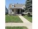 Charming single-Gathering home featuring a covered porch, well-maintained lawn, and traditional design at 2050 Winton Ave, Indianapolis, IN 46224