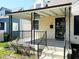 Inviting front porch with covered awning, decorative railings, and a clear view of the home's entrance at 2050 Winton Ave, Indianapolis, IN 46224