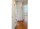 A hallway showcasing a white storage cabinet and hardwood floors at 2050 Winton Ave, Indianapolis, IN 46224