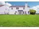 Large, well-maintained backyard with a view of the home's exterior at 2236 Willowview Dr, Indianapolis, IN 46239