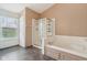 Bathroom features a soaking tub, shower and window for natural light at 2236 Willowview Dr, Indianapolis, IN 46239
