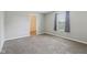Spacious carpeted bedroom with a window, light-gray walls, and a walk-in closet at 2236 Willowview Dr, Indianapolis, IN 46239