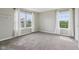 Bedroom with natural light, neutral paint, carpeting, and two double hung windows at 2236 Willowview Dr, Indianapolis, IN 46239