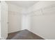 Carpeted walk-in closet featuring white walls and metal shelving for optimal storage at 2236 Willowview Dr, Indianapolis, IN 46239